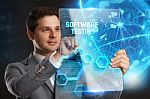 Business, Technology, Internet And Network Concept. Young Businessman Showing A Word In A Virtual Tablet Of The Future: Software Testing Stock Photo