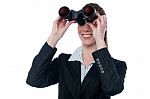 Business Woman Looking Through Binoculars Stock Photo