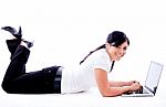 Business Woman Lying With Laptop Stock Photo