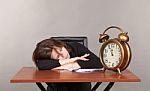 Business Woman Sleeping At The Table Stock Photo