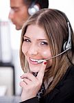 Business Woman Speaking Through Head Phone Stock Photo