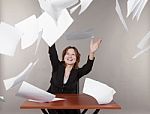 Business Woman Throwing Up Documents Stock Photo
