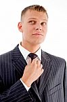 Businessman Adjusting His Tie Stock Photo