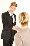 Businessman And Woman Shaking Hands Stock Photo