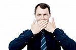 Businessman Covering His Mouth With Hands Stock Photo