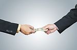 Businessman Hand And Money To Other For Corruption Stock Photo