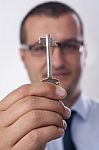 Businessman Handing Over A Key To You Stock Photo