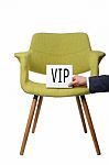 Businessman Hold White Paper Note "vip" On Modern Green Armchair Stock Photo