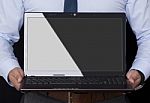 Businessman Holding A Laptop Stock Photo
