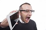 Businessman Holding A Table  And Screaming Stock Photo