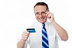 Businessman Holding Credit Card Stock Photo