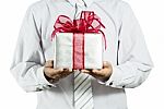 Businessman Holding Gift Box Stock Photo