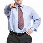 Businessman In Blue Shirt Pointing With Index Finger To Us Stock Photo