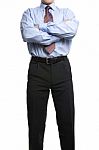 Businessman In Blue Shirt Stands With Crossed Folded Hands Stock Photo