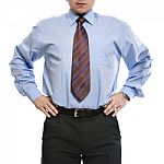 Businessman In Blue Shirt Stands With Hands On The Waist Stock Photo