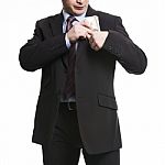 Businessman In Dark Suit Puts A Bunch Of American Dollars Into J Stock Photo