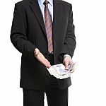 Businessman In Dark Suit Shows A Spread Of 20 British Pounds Ste Stock Photo