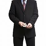 Businessman In Dark Suit With A Bunch Of American Dollars Stock Photo