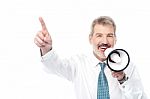 Businessman Making An Announcement By Loudhailer Stock Photo