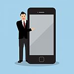 Businessman Pointing To The Screen Of A Smartphone Stock Photo