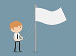 Businessman Raising A Flag Stock Photo