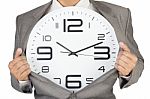 Businessman Showing Clock In Suit Stock Photo