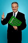 Businessman Showing Thumbs Up, Holding Calculator Stock Photo