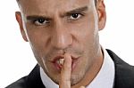 Businessman Shushing With Close Up Pose Stock Photo