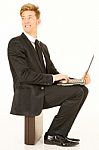 Businessman Sitting With Laptop Stock Photo