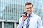 Businessman Standing Outside Modern Building Stock Photo