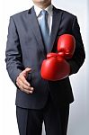 Businessman Take Off Boxing Gloves To Offer A Handshake On White Stock Photo