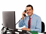 Businessman Talking On Phone, Handling Clients Stock Photo