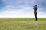 Businessman Using Binoculars Stock Photo