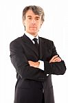 Businessman With Arms Crossed Stock Photo
