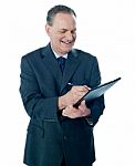 Businessman with clipboard Stock Photo