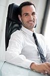 Businessman With Earphones Stock Photo