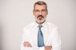Businessman With Folded Arms Stock Photo