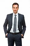 Businessman With Hand In Pockets Stock Photo