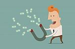 Businessman With Horseshoe Magnet Collecting Money Stock Photo