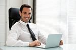 Businessman With Laptop Stock Photo