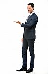 Businessman With Lifted Arm Stock Photo