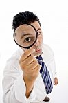 Businessman With Magnifying Glass Stock Photo