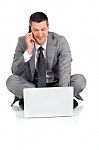 Businessman With Mobile And Laptop Stock Photo