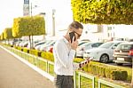 Businessman With Mobile Phone And Tablet In Hands Stock Photo