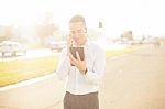 Businessman With Mobile Phone Tablet In Hands Stock Photo