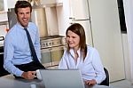 Businesspeople In Kitchen Stock Photo