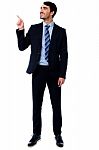 Businesssman Looking And Pointing Upwards Stock Photo