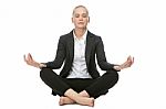 Businesswoman In Yoga Position Stock Photo