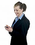Businesswoman Reading Message On Her Mobile Stock Photo