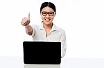 Businesswoman Showing Thumbs Up Gesture Stock Photo
